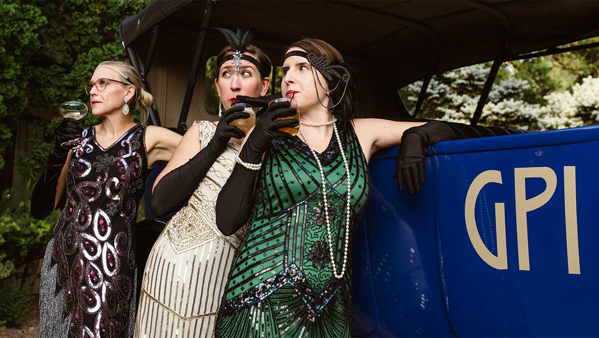 Group of women sipping on cocktails 