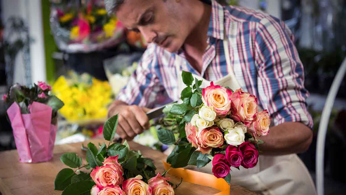 Florist preparing bouquet.