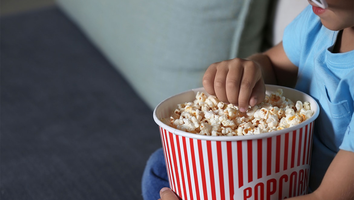 Kid eating popcorn