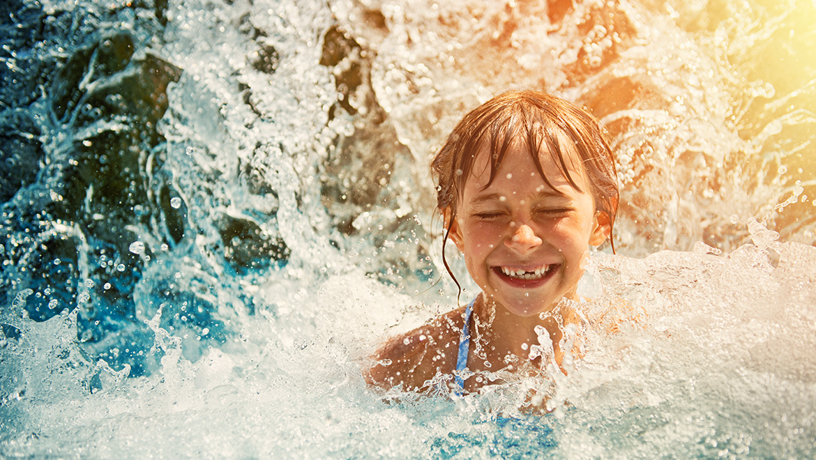 Girl splashing in wave pool
