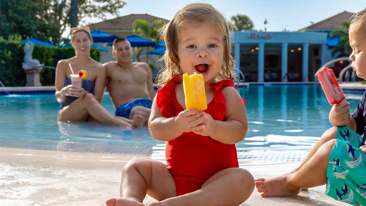 Kids having ice cream by the pool