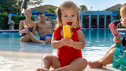 Kids having ice cream by the pool