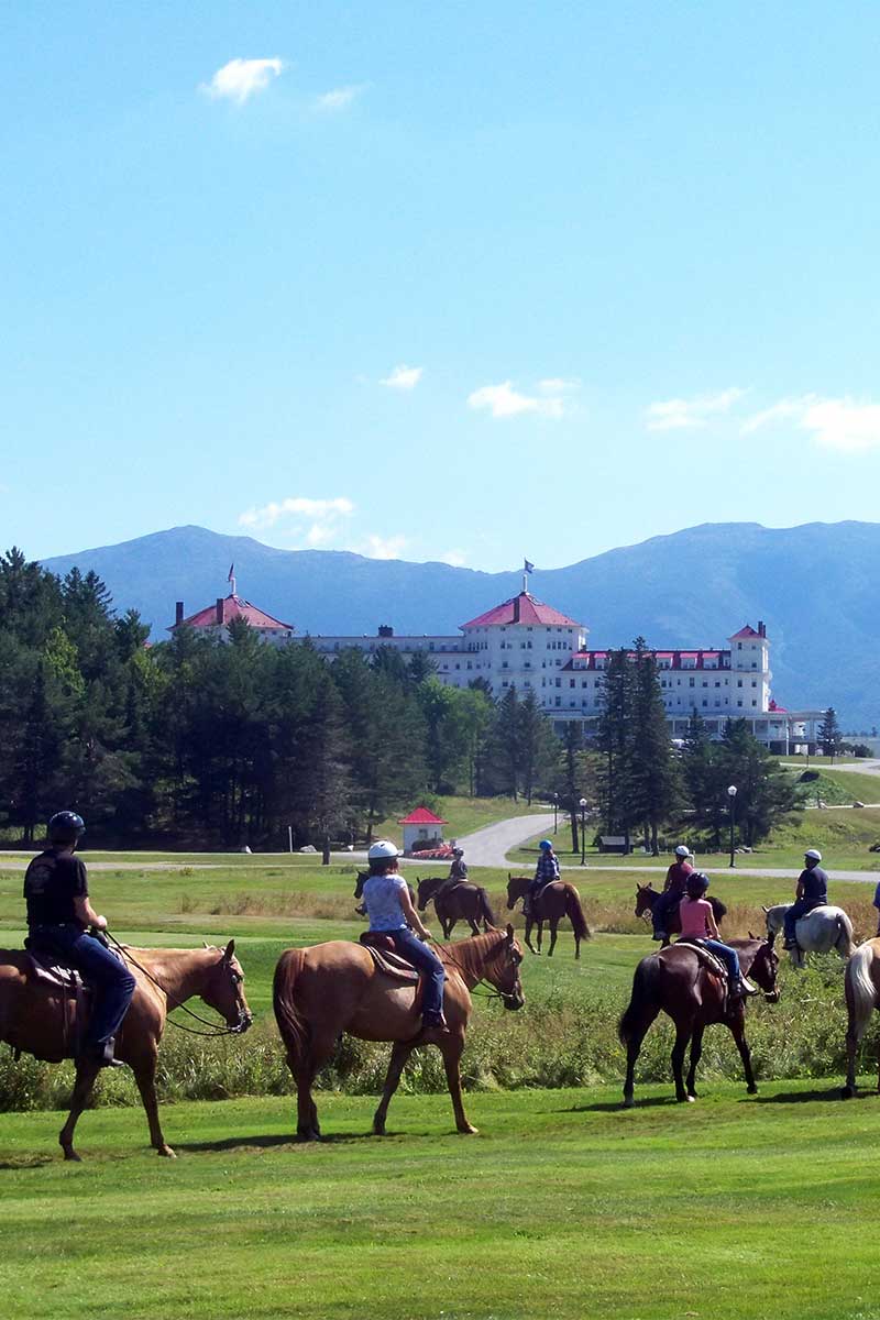 Group of tourists riding ponies