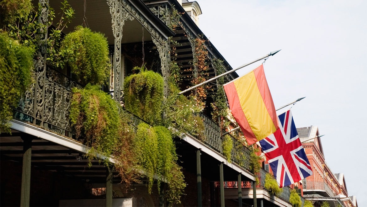 New Orleans balconies with Spanish and British flags