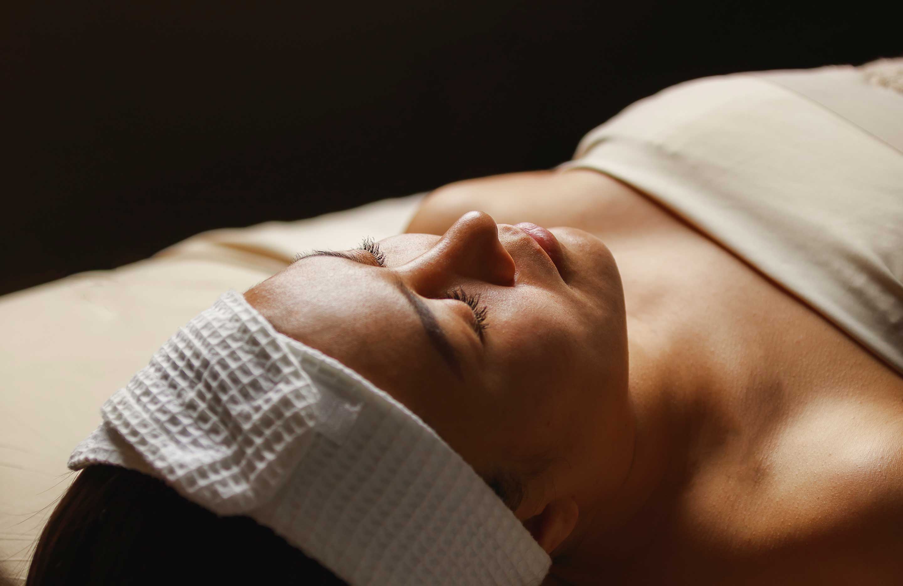 Woman relaxing on a massage table.