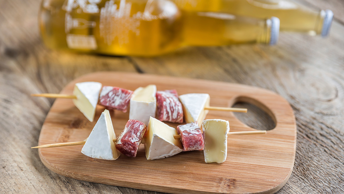 Meat and cheese appetizer on a skewer