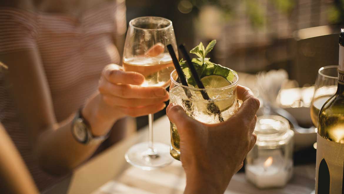 People toasting beverages.