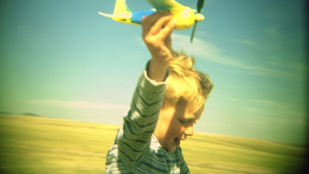 Kid with paper airplane