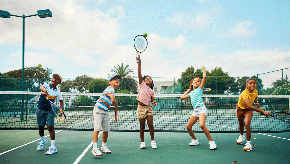 5 kids playing tennis
