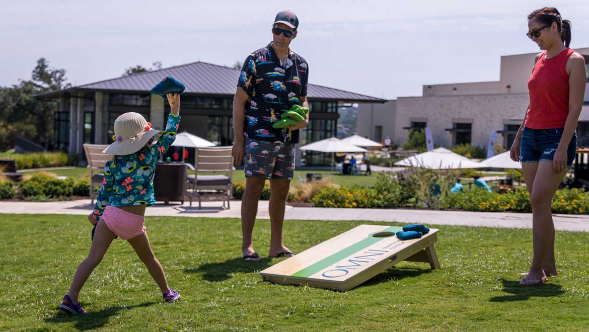 People playing cornhole