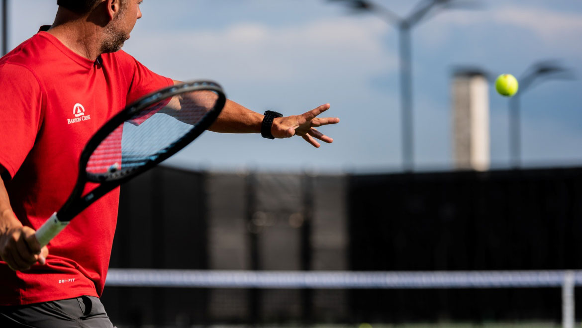 Man serving a tennis ball