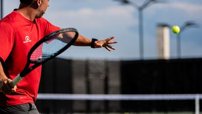 Man serving a tennis ball