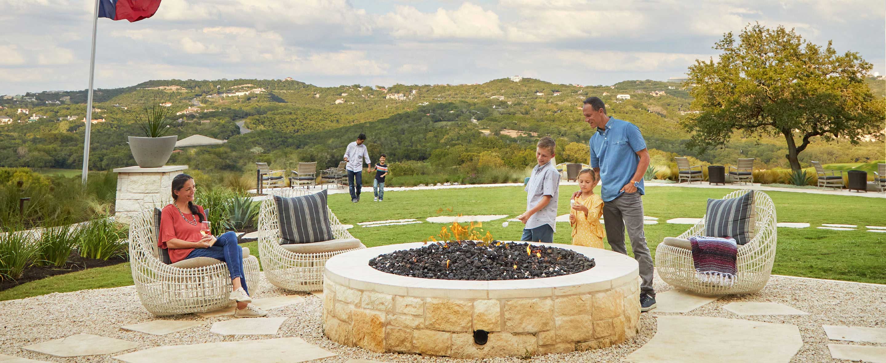 Family gathered by a firepit