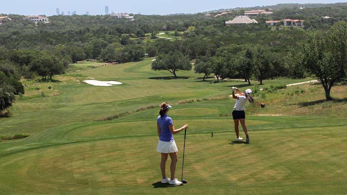 two women playing golf