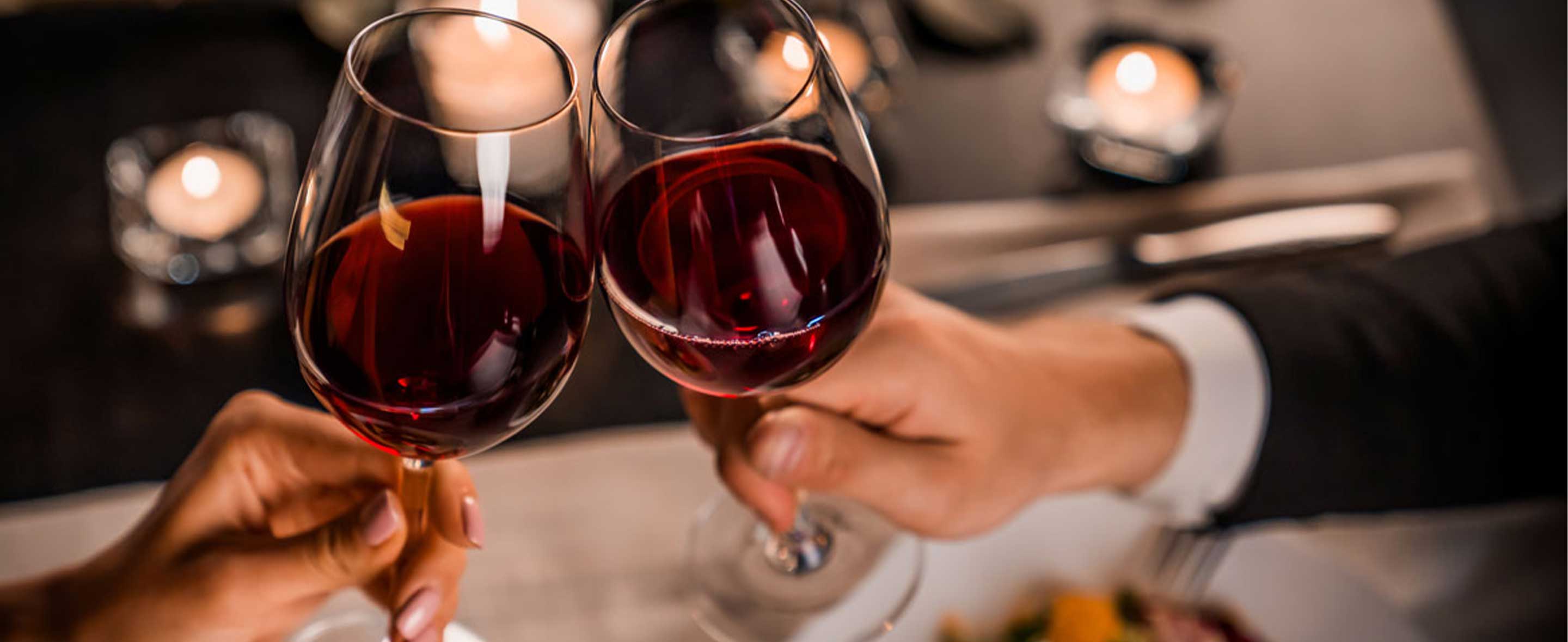 Couple holding a glass of wine