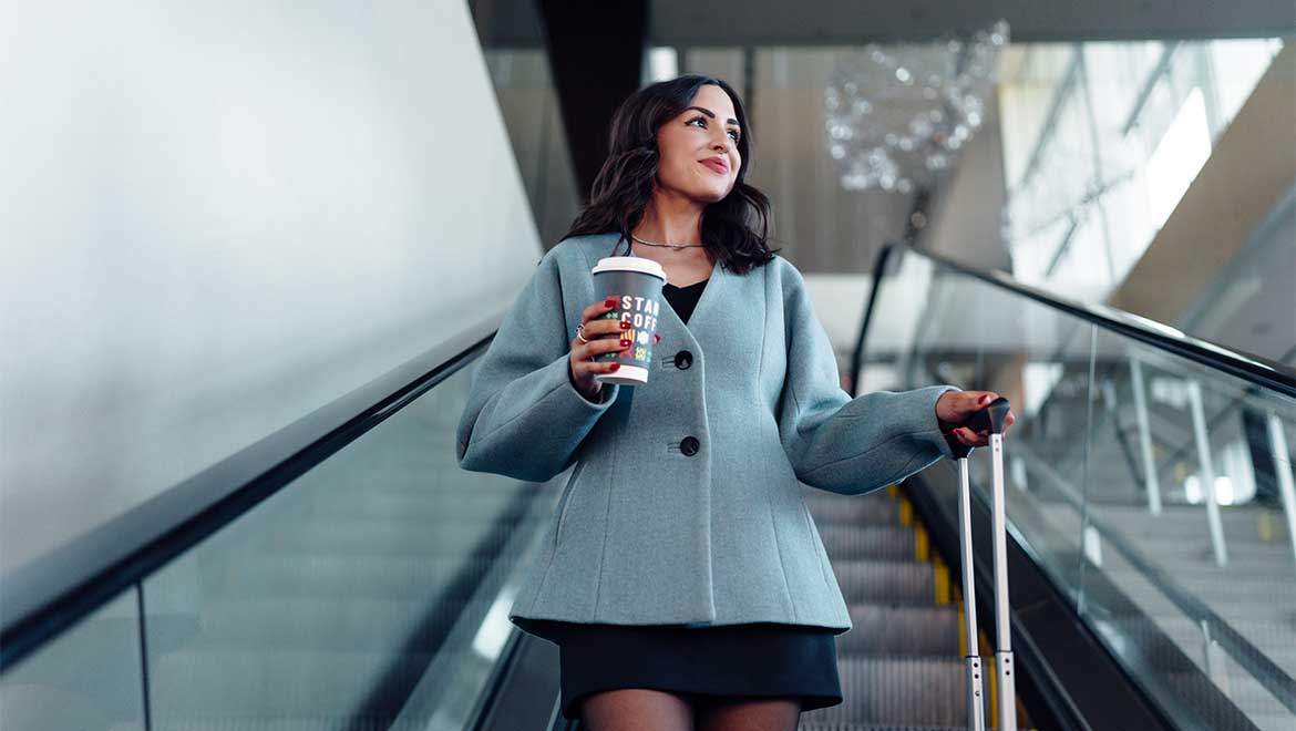 Hotel guest going down an escalator