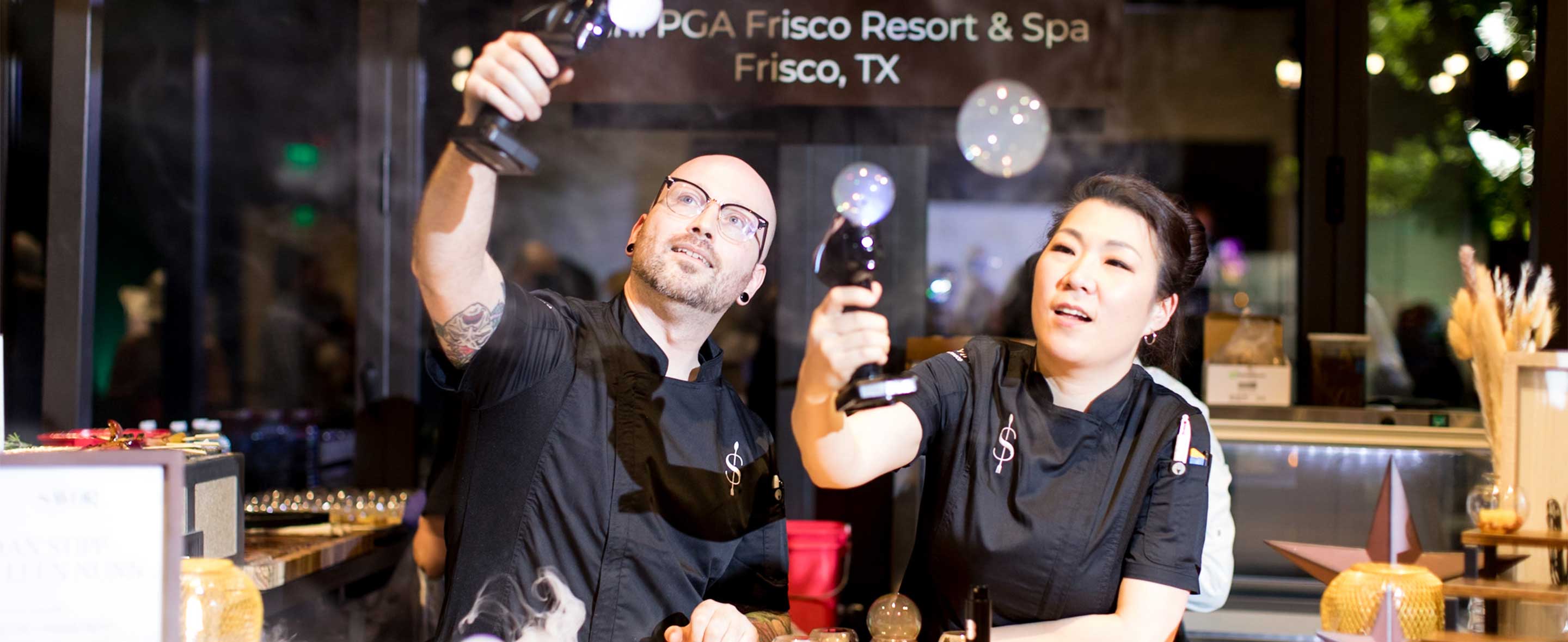 Two chefs sitting at a table