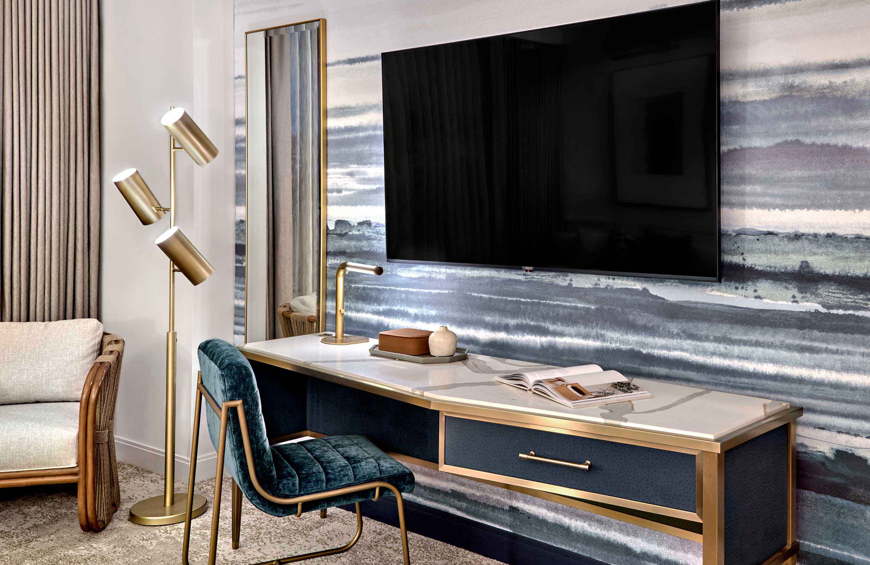 Room desk area with wall mounted t.v.