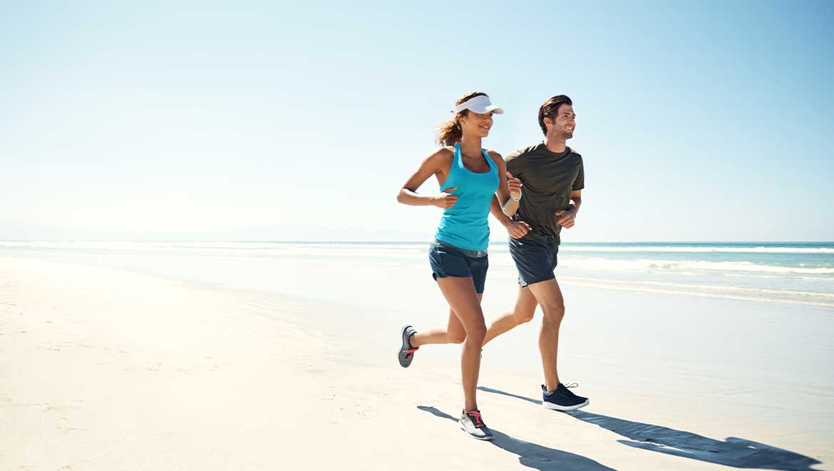 Couple running on the beach