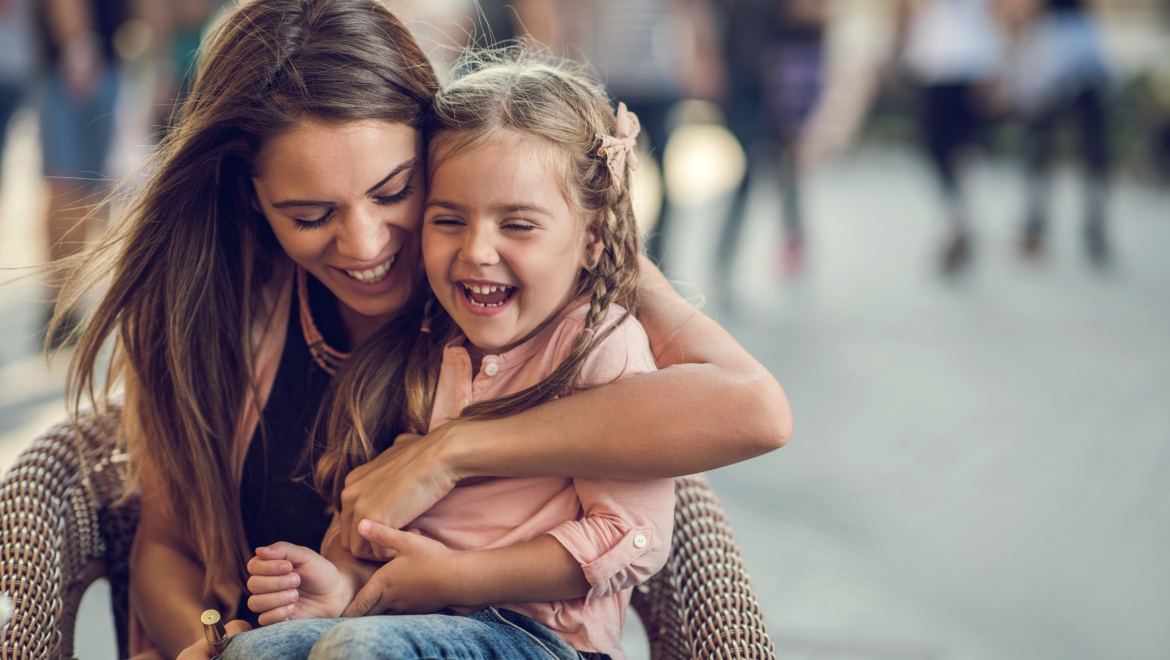 Mother and daughter laughing