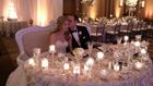 Bride and groom sitting at table