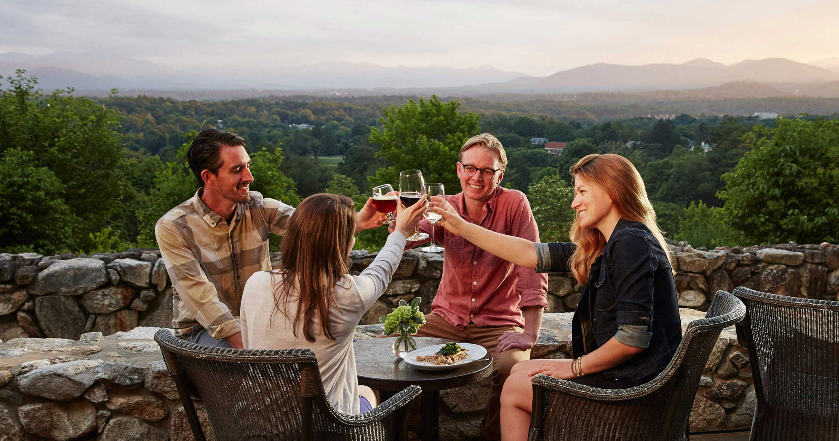 Group of friends toasting wine.