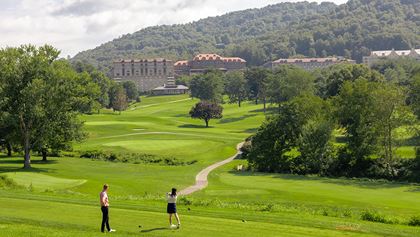 Man and woman golfing