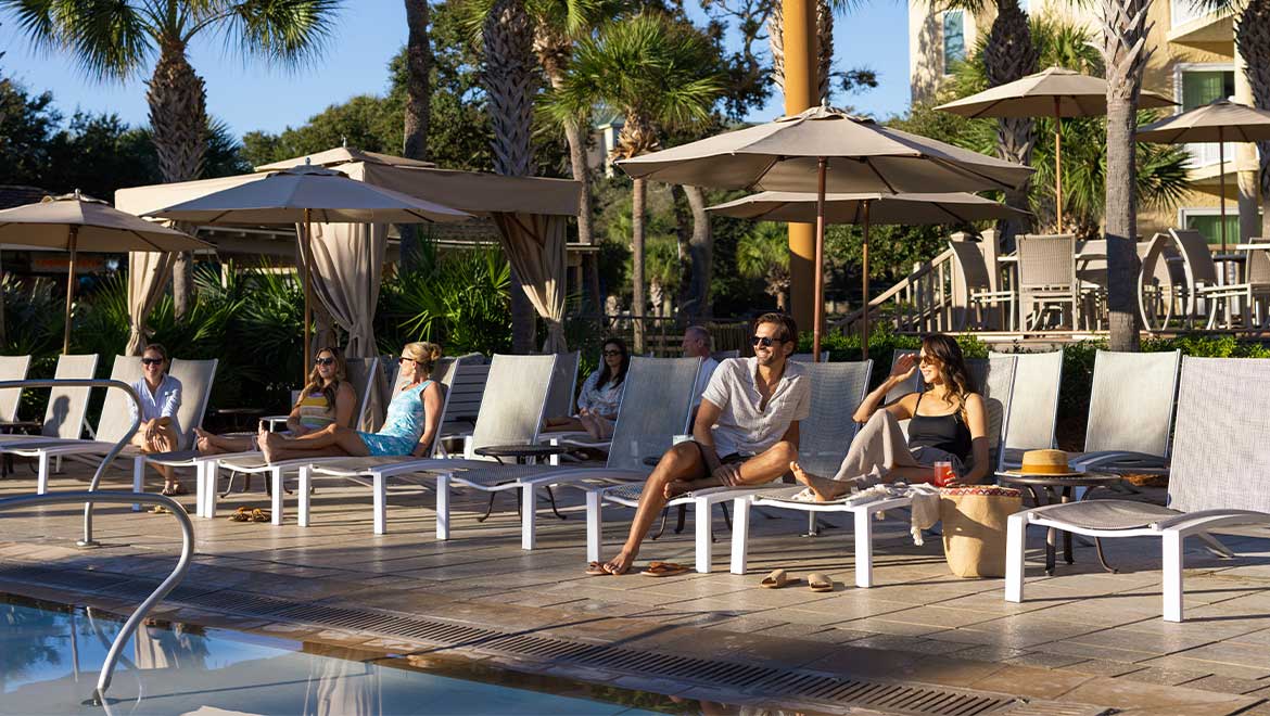 Guests relaxing by the pool