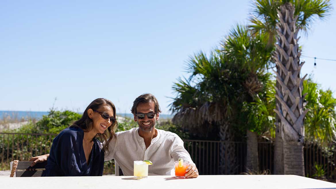 Couple having drinks on the patio