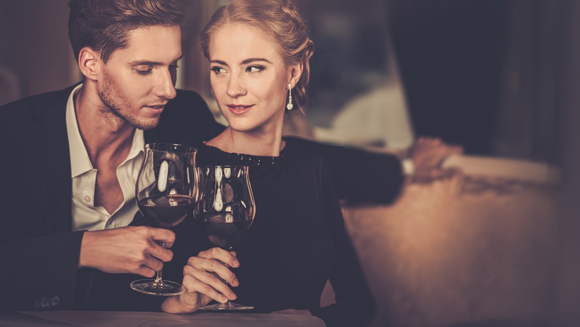 Couple having wine dinner