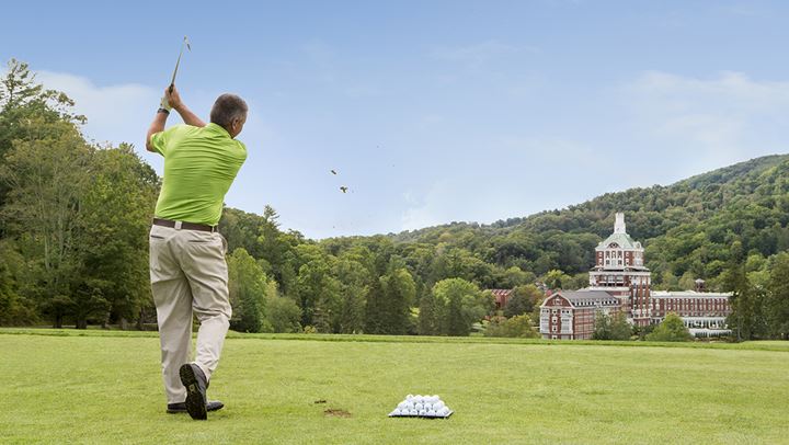 Man practicing on driving range