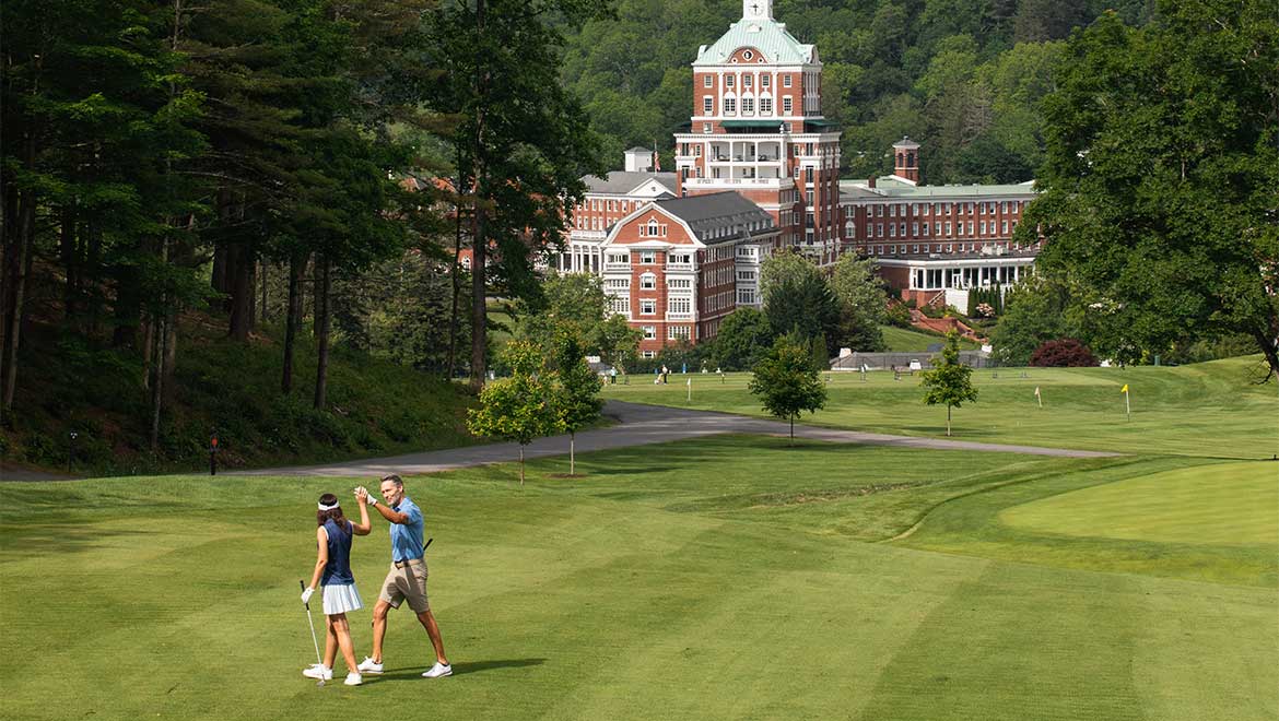 Couple golfing on golf course