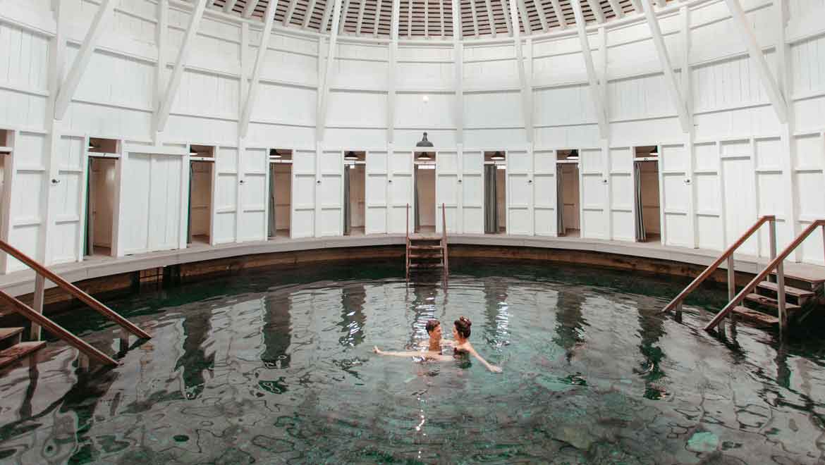 Couple swimming in spa pool