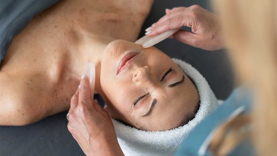 Woman receiving facial treatment