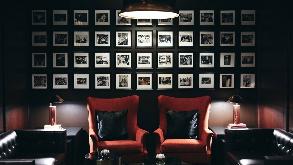 Tables and plush seating in restaurant.