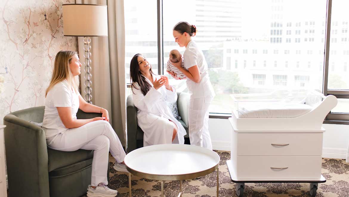 Mother reaching out to hold her baby