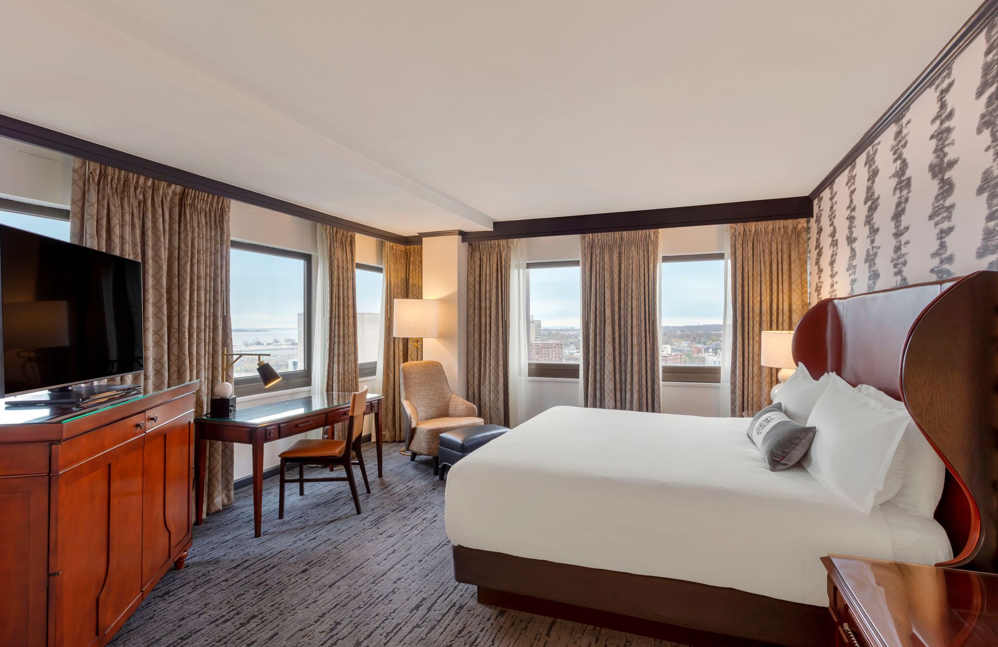 Interior hotel room with view.