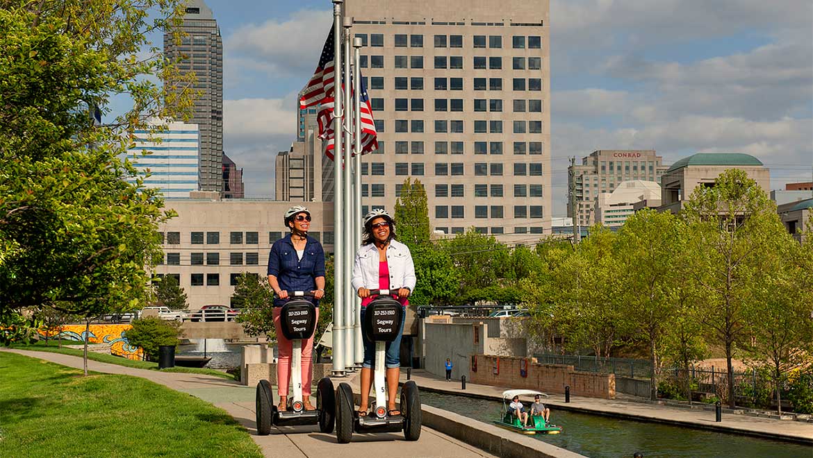 People riding Segways.