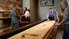 People playing shuffleboard
