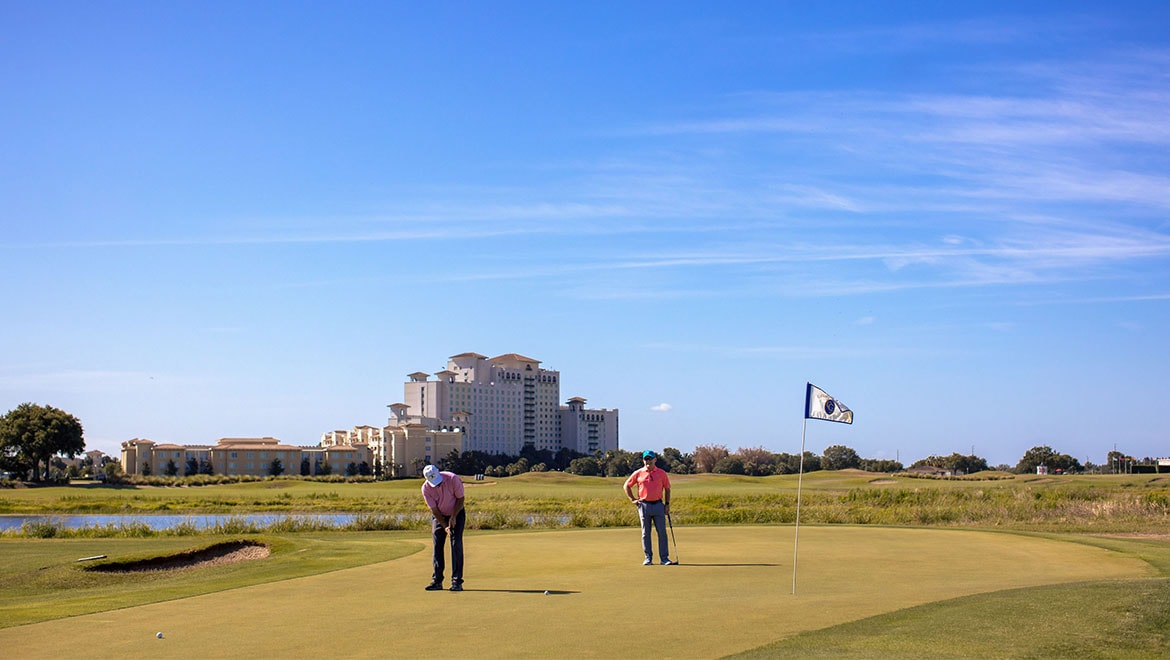 Two Golfers Putting at ChampionsGate Golf Club