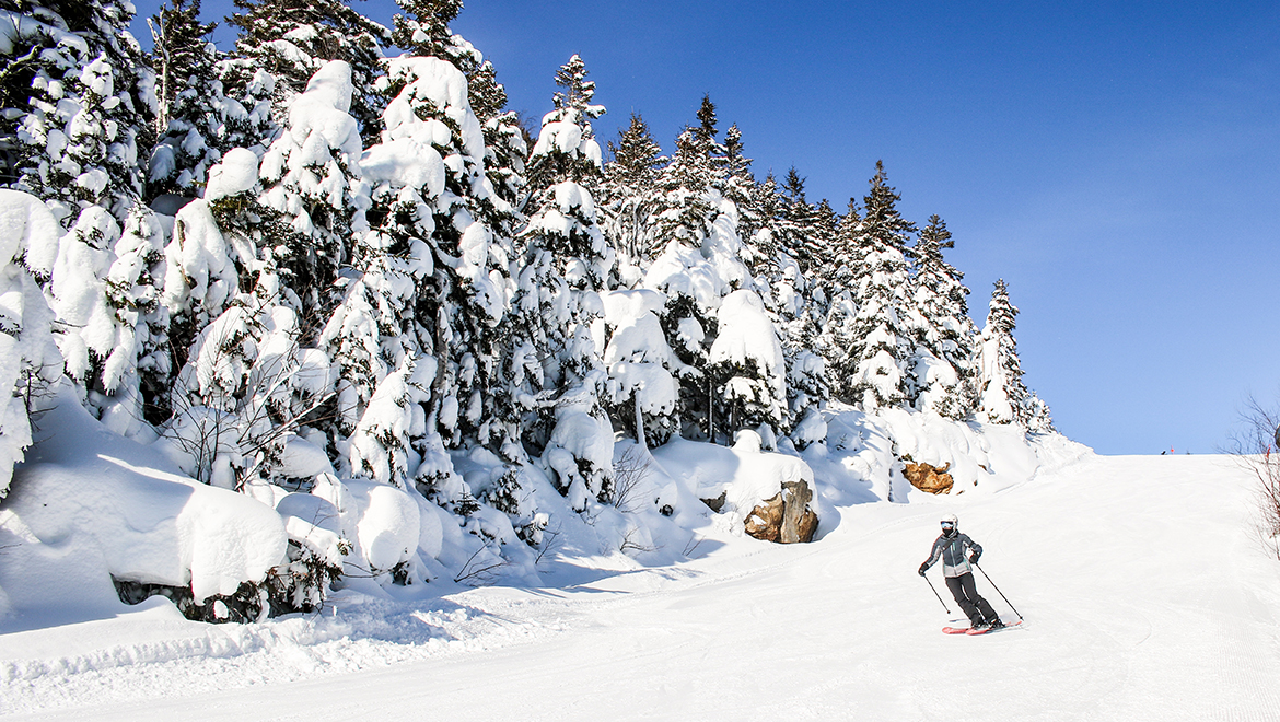 Skier going down a slope