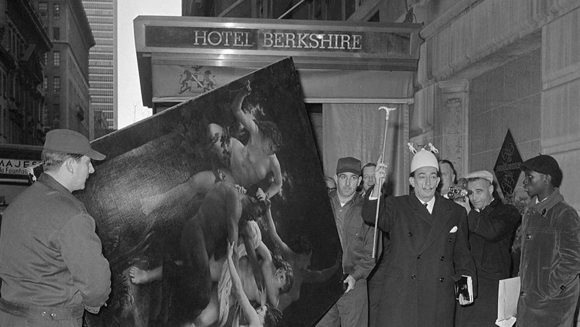 Group of people walking with a painting