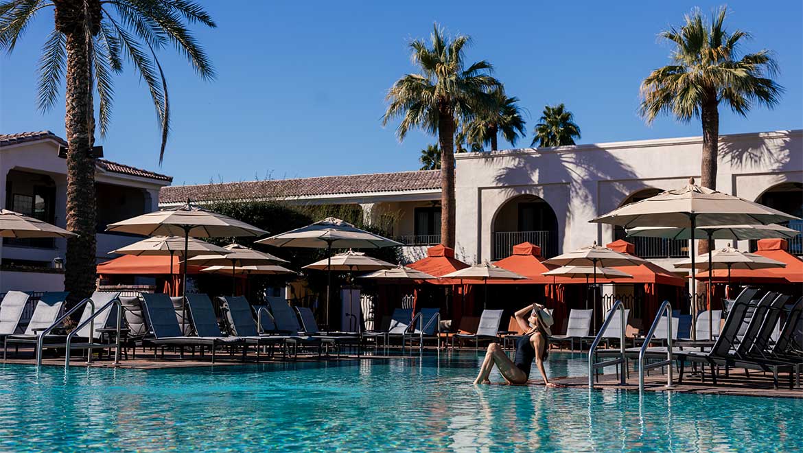 Woman sitting by the pool