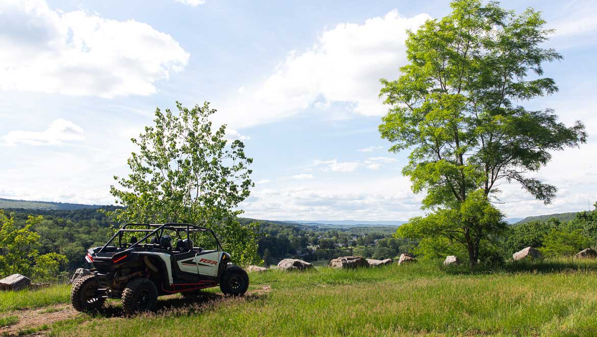 Off road vehicle overlooking the valley.