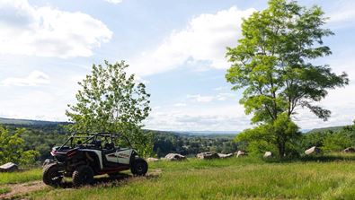 Off road vehicle overlooking the valley.