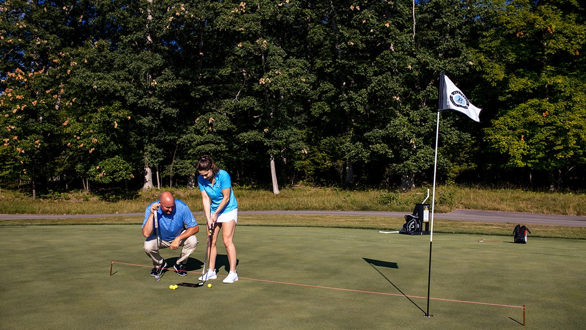 Person receiving golf lesson