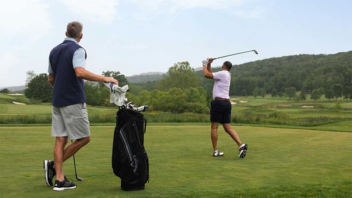 Two men golfing