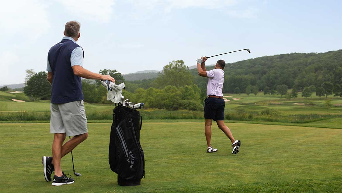 Two men golfing