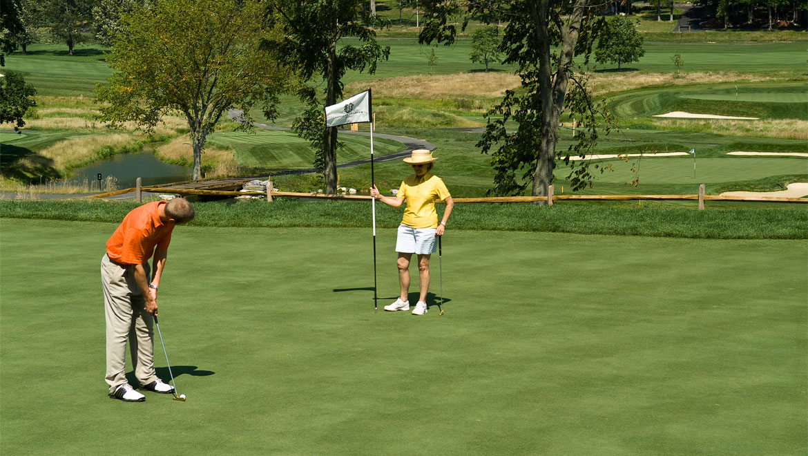 Couple golfing at Bedford Springs golf course 