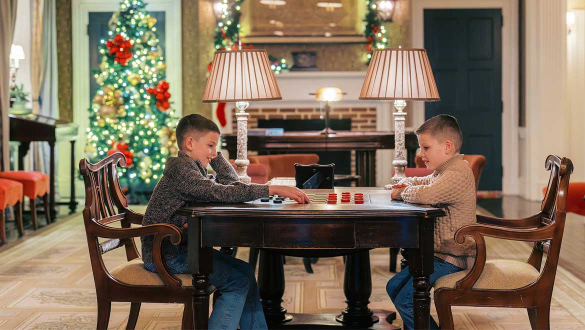 Two kids playing checkers